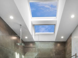 skylights in bathroom with shower head and grey interior design in perth